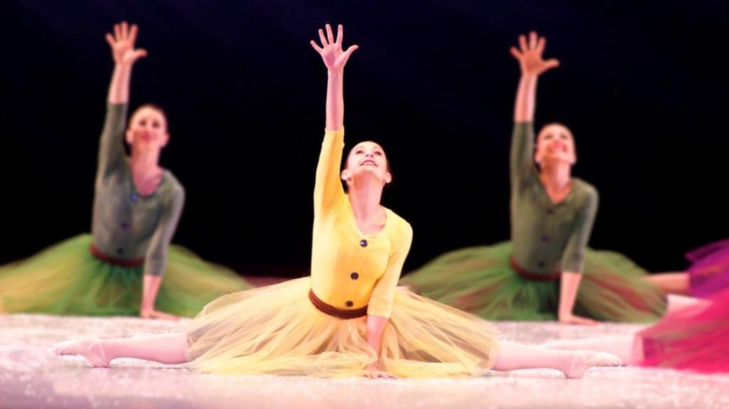Ballet dancers performing in colorful costumes