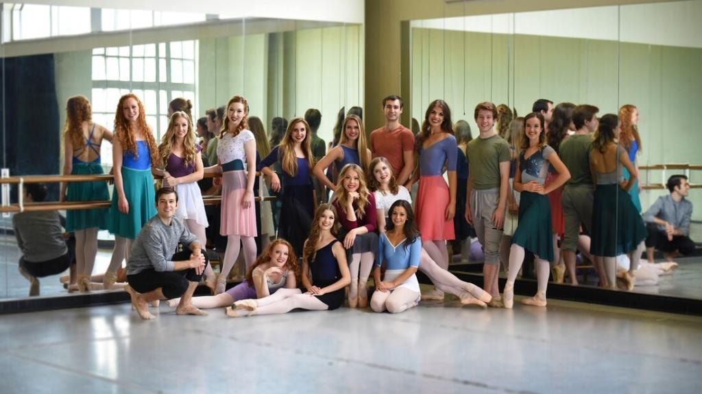 Ballet company group photo in rehearsal studio